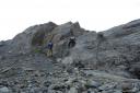 Dan Hensley and Jayson Ayers climbing down the rock face on the far side of Worthington Glacier